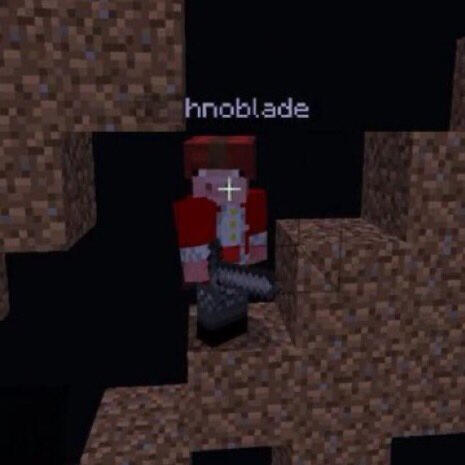 Technoblade wearing a leather cap and holding a stone sword standing on a dirt staircase