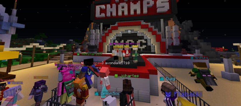 The Purple Pandas (Wilbur Soot, Tommy Innit, Technoblade, and Philza) with Minecraft Championship crowns on the champion stage